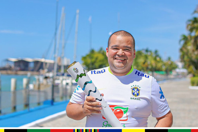 Ricardo Sales with Olympic Flame