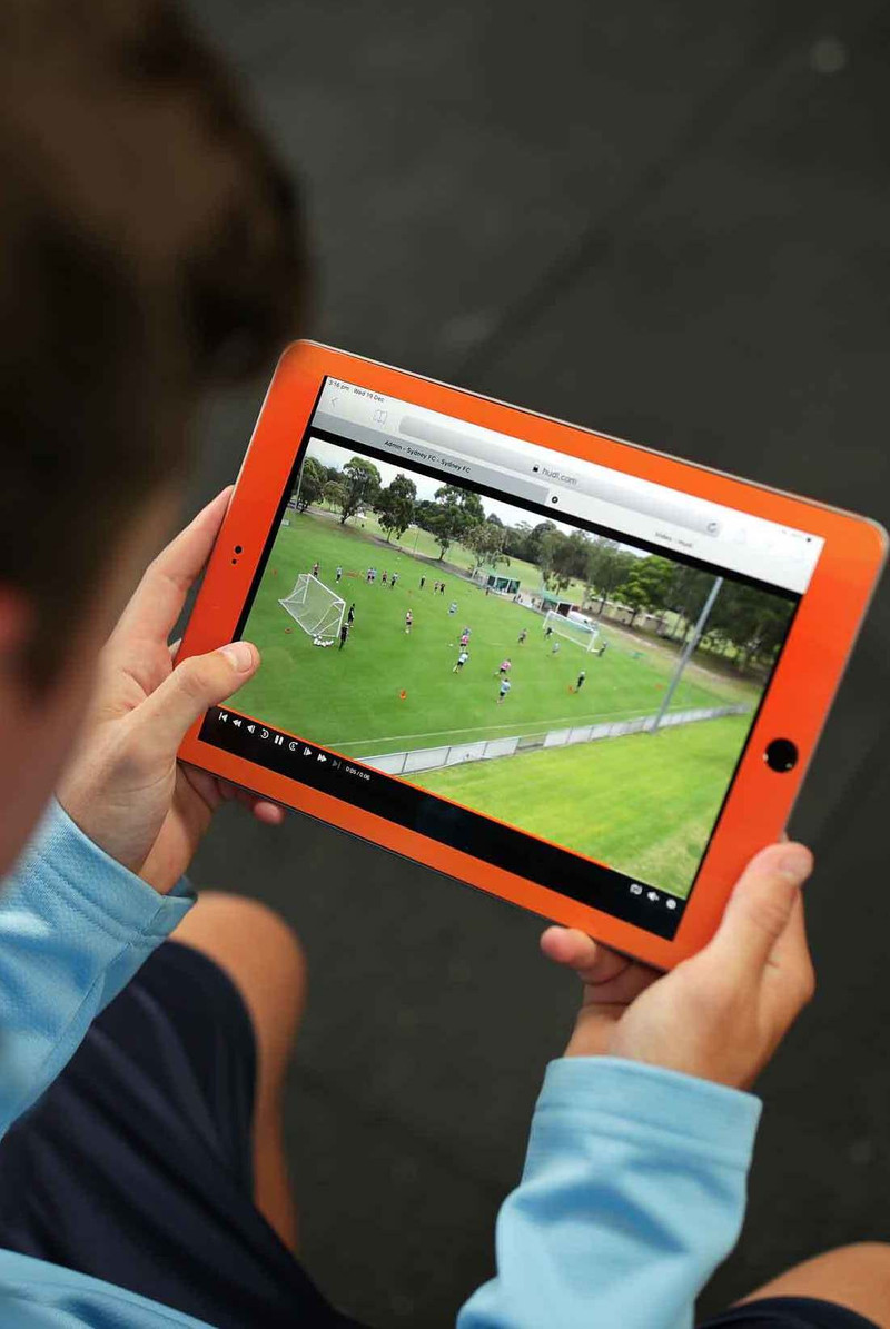 Sydney FC player reviewing soccer gameplay on Hudl tablet